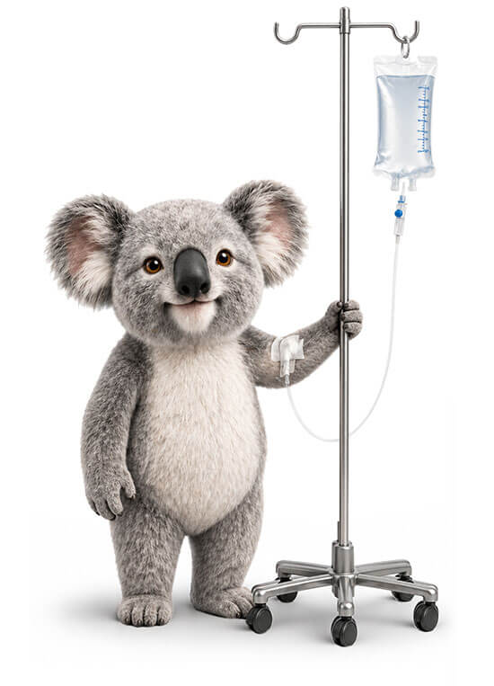 Simple Benefit Options koala mascot standing beside an IV pole, representing critical illness insurance and financial support during serious health events.